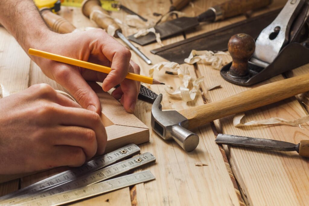 Carpentry_Desk_Hands_Shutterstocl